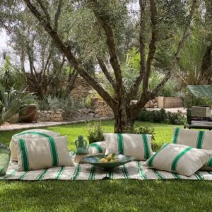 Set of Moroccan pouf, cushions, and picnic blanket in mint stripe design on natural wool