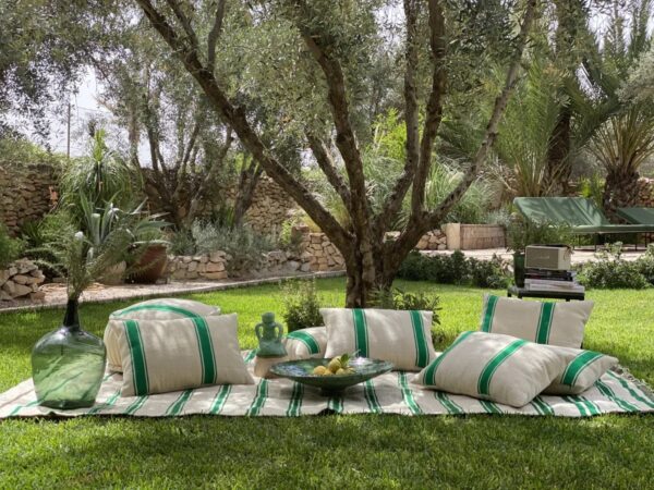 Set of Moroccan pouf, cushions, and picnic blanket in mint stripe design on natural wool